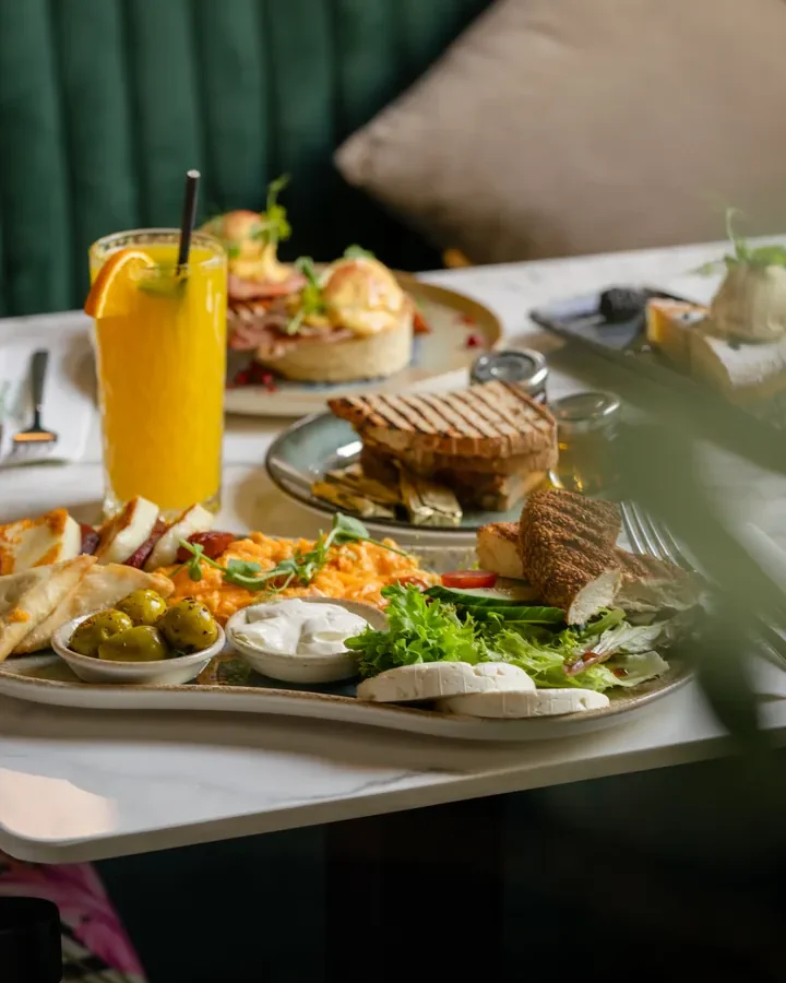 A brunch spread with fresh orange juice